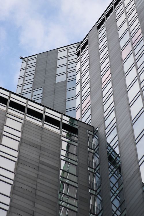 Free Close-up of a modern skyscraper in Milan, showcasing architectural lines. Stock Photo