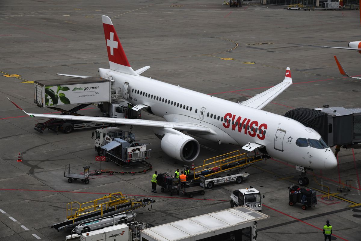 Swiss Airbus at Geneva Airport terminal - travel cancellation and cruise support