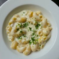 Creamy pasta in a white bowl — photo by Nikhil KH on Pexels