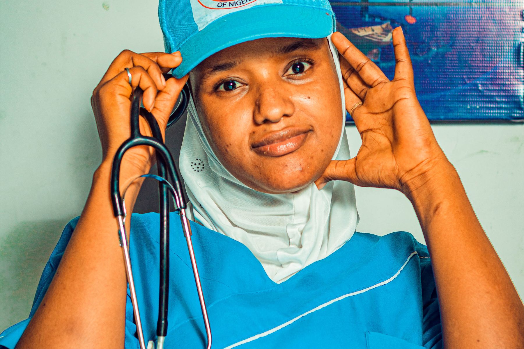 Smiling nurse in clinical attire representing a welcoming patient experience