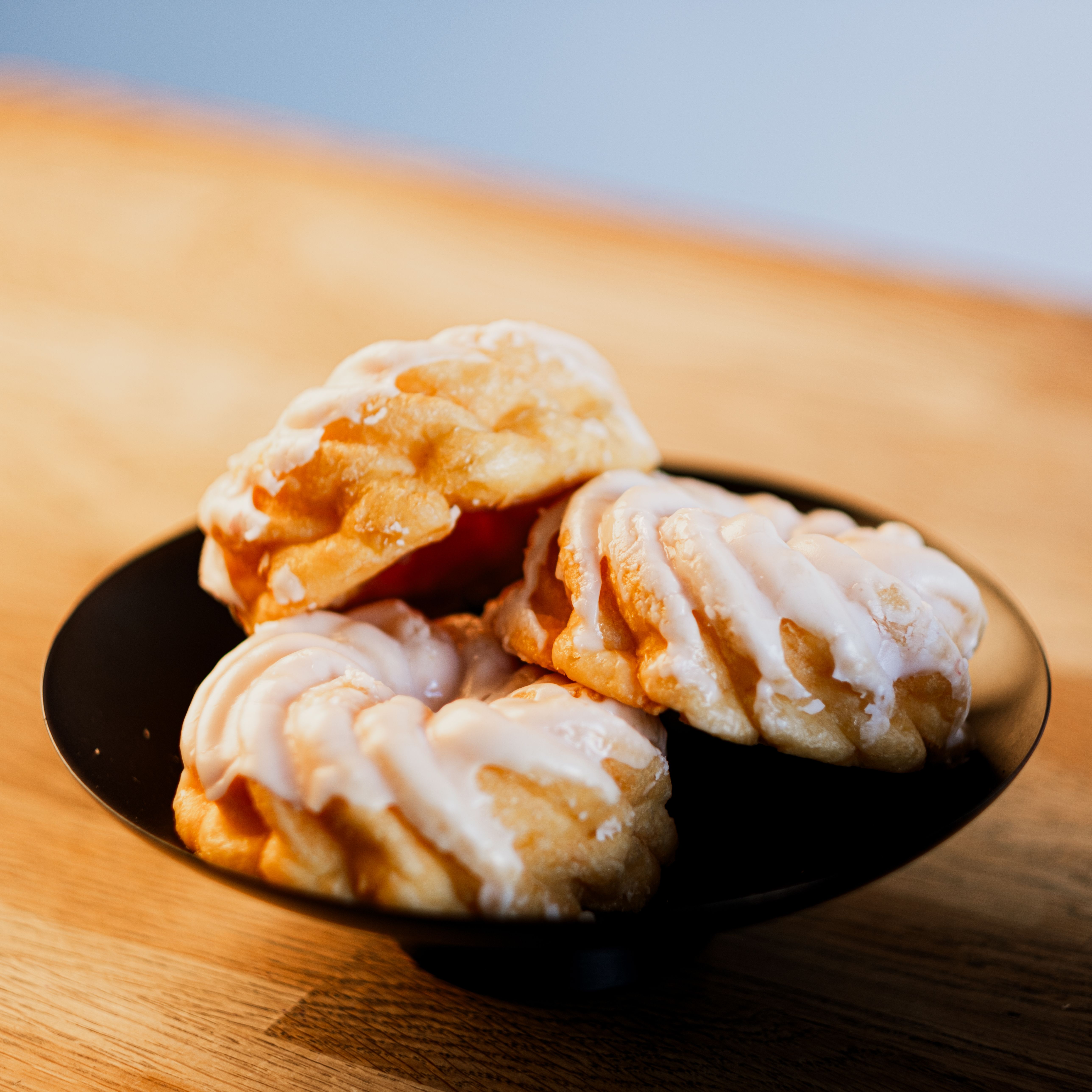 golden pastries on a bakery tray
