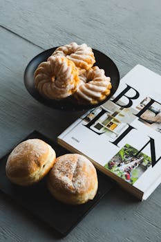 Delicious German pastries and a travel book about Berlin on a table.