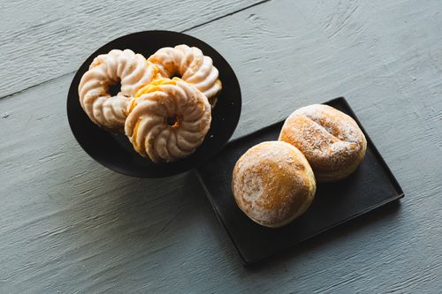 Free Aerial view of German donuts and pastries showcasing food aesthetics in a minimalist style. Stock Photo