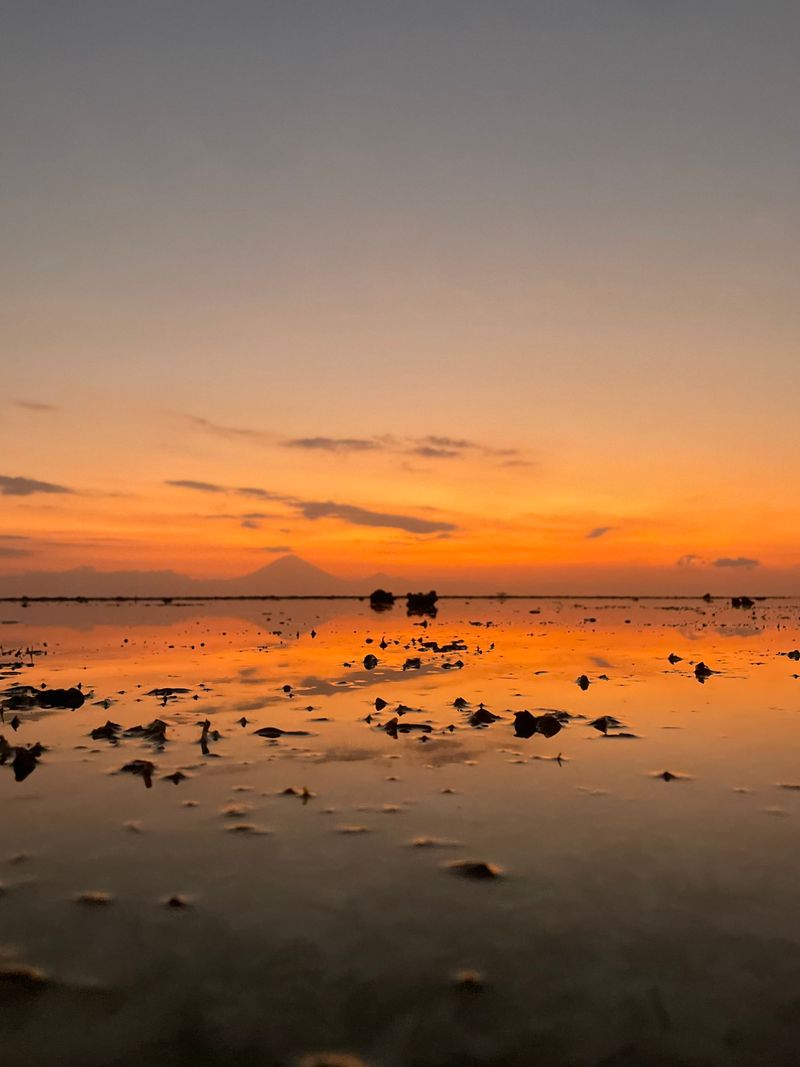 Stunning sunset over the Gili islands beach