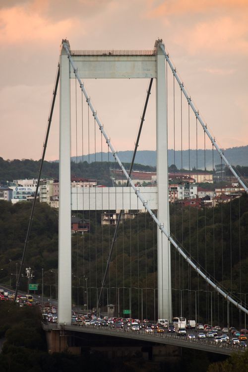 Free Traffic jam on the Bosphorus Bridge at sunset in Istanbul, Turkey, with urban skyline. Stock Photo