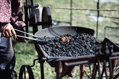 Portable coal forge in the yard — photo by Owen.outdoors on Pexels