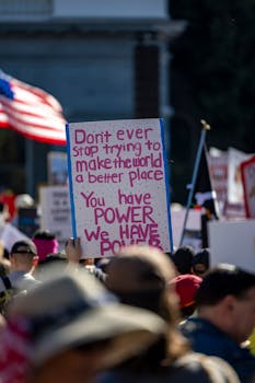 A vibrant protest scene in Sacramento with empowering messages for change.