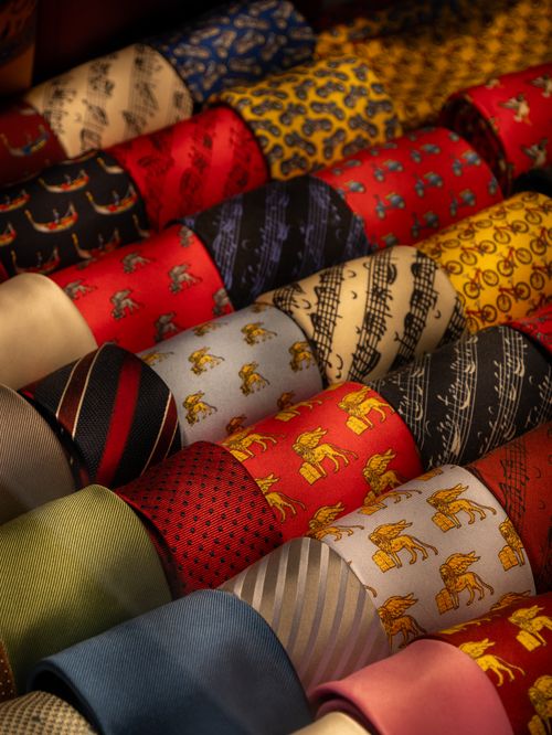 Free A collection of colorful patterned neckties neatly arranged in rows, showcasing unique designs and vibrant colors. Stock Photo