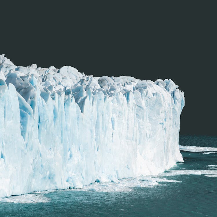Rough Floating Iceberg In Arctic Ocean