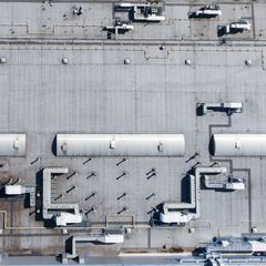 Aerial view of an industrial plant roof — photo by Curioso Photography on Pexels