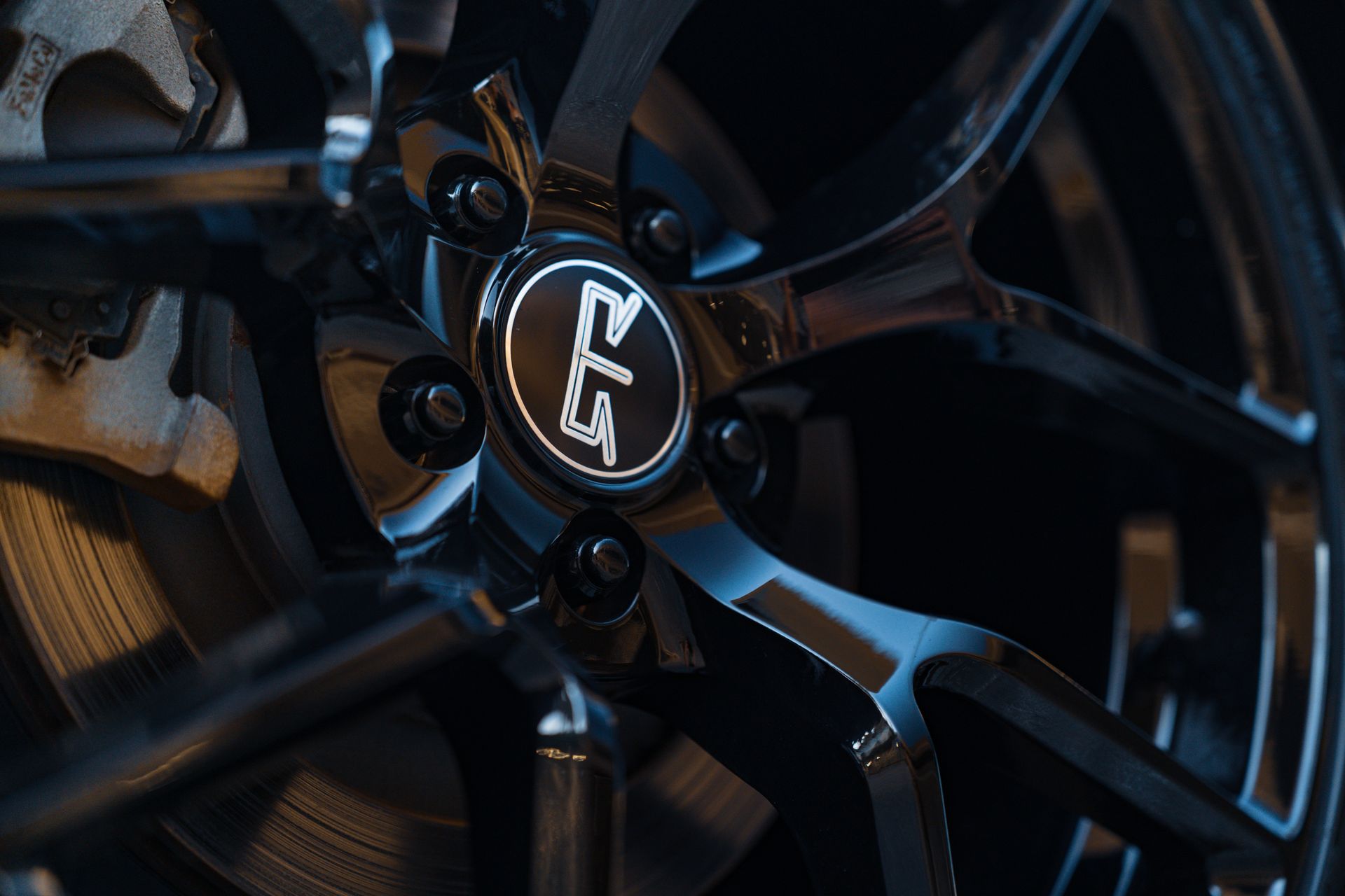 High-resolution image showcasing a detailed view of a glossy car wheel rim, highlighting its modern design.