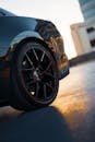 Close-up of Luxury Car Wheel at Sunset