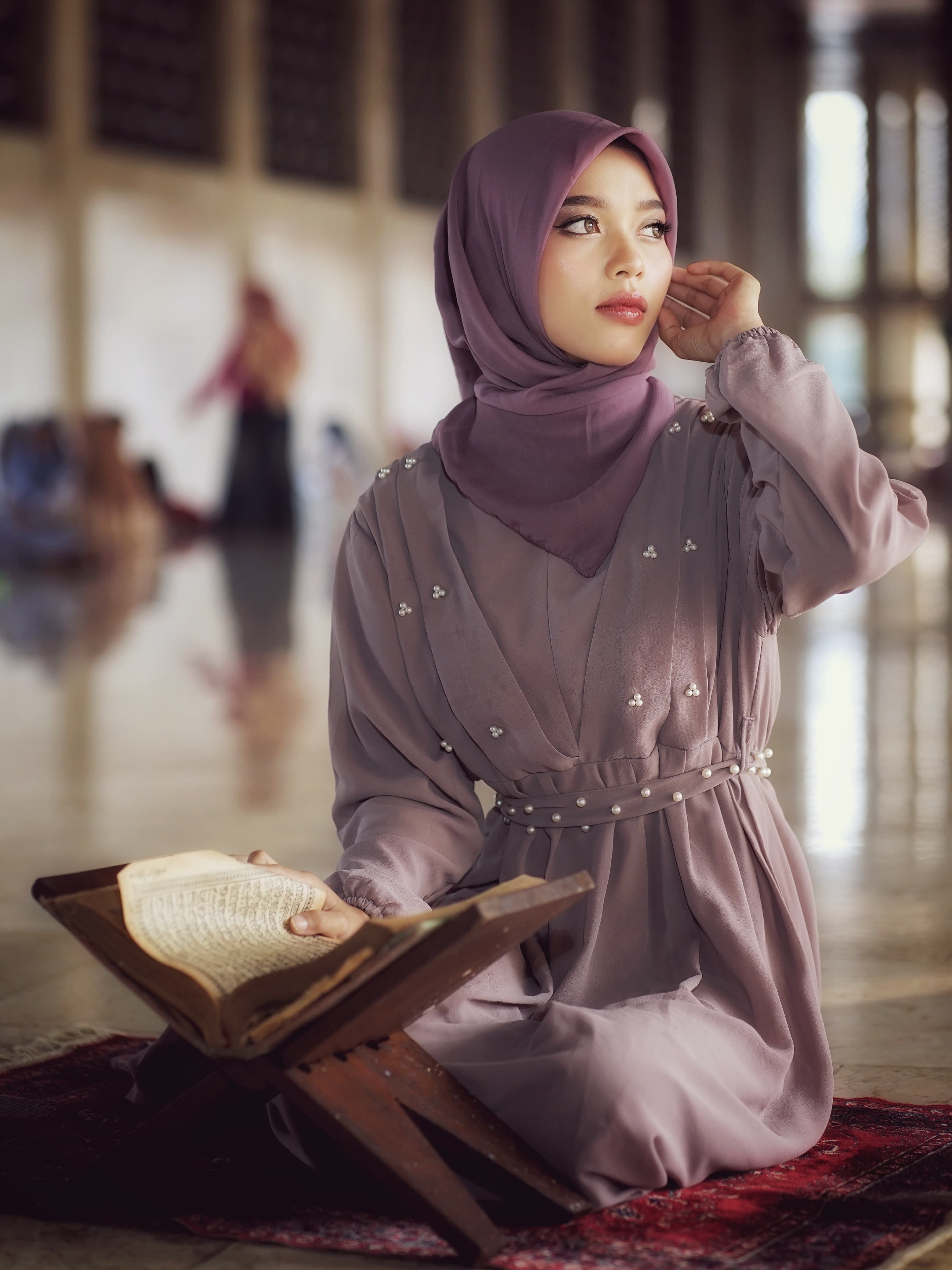 Young Woman Reading a Holy Book Indoors