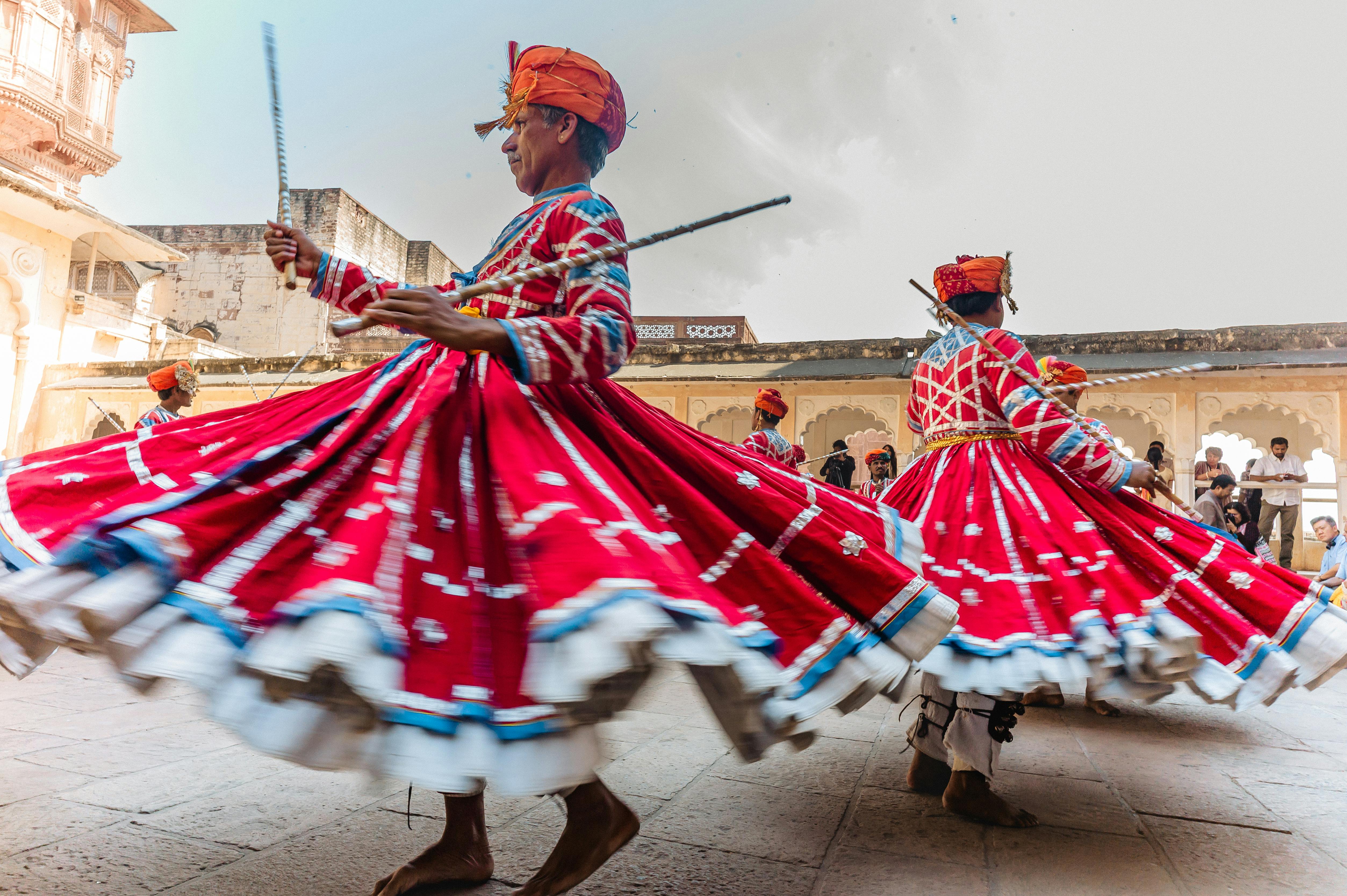 Vibrant traditional dancers performing at Mehrangarh Fort in Jodhpur, Rajasthan.