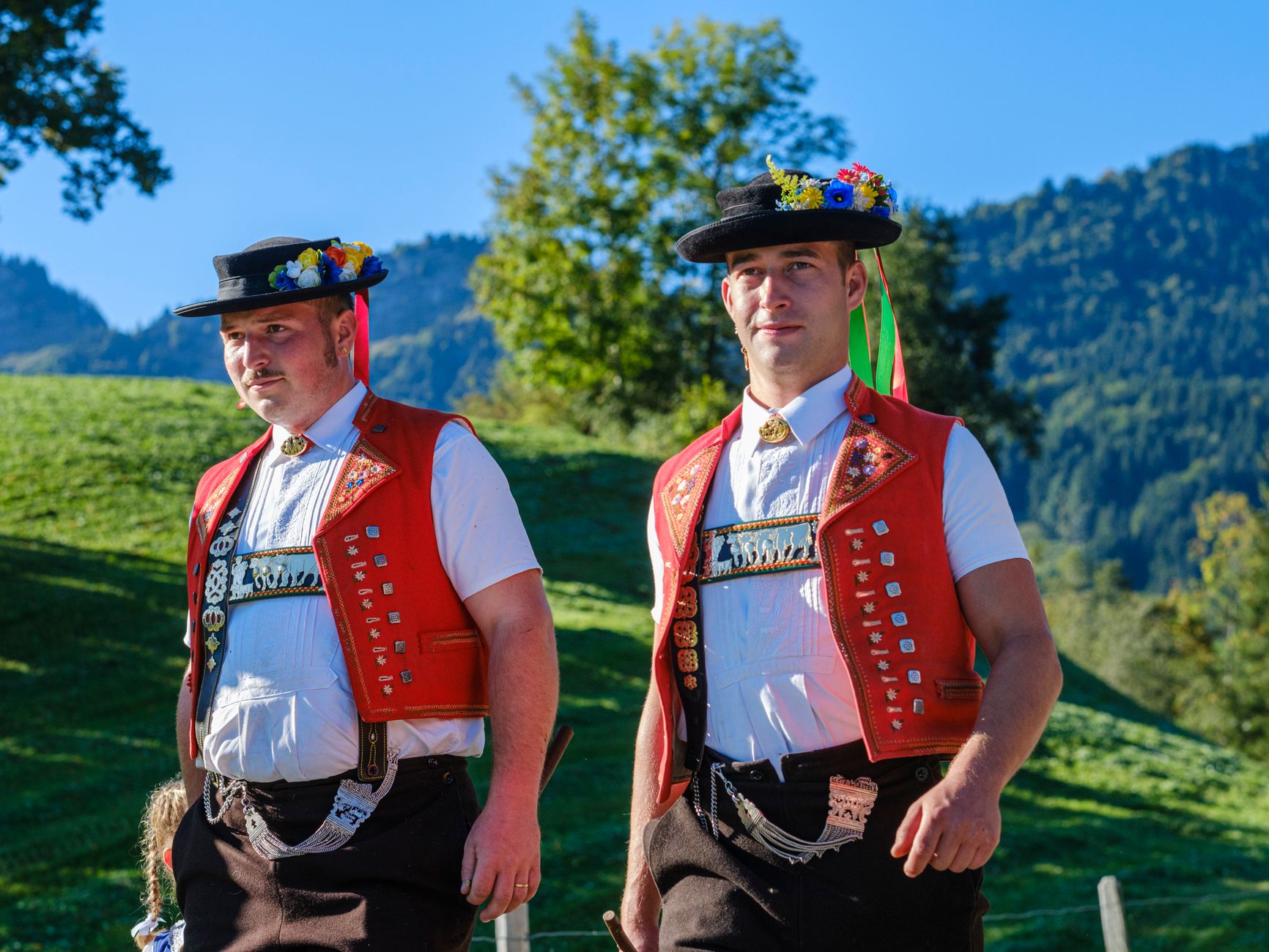 Men in traditional Swiss attire enjoying the outdoors in Appenzell Ausserrhoden.