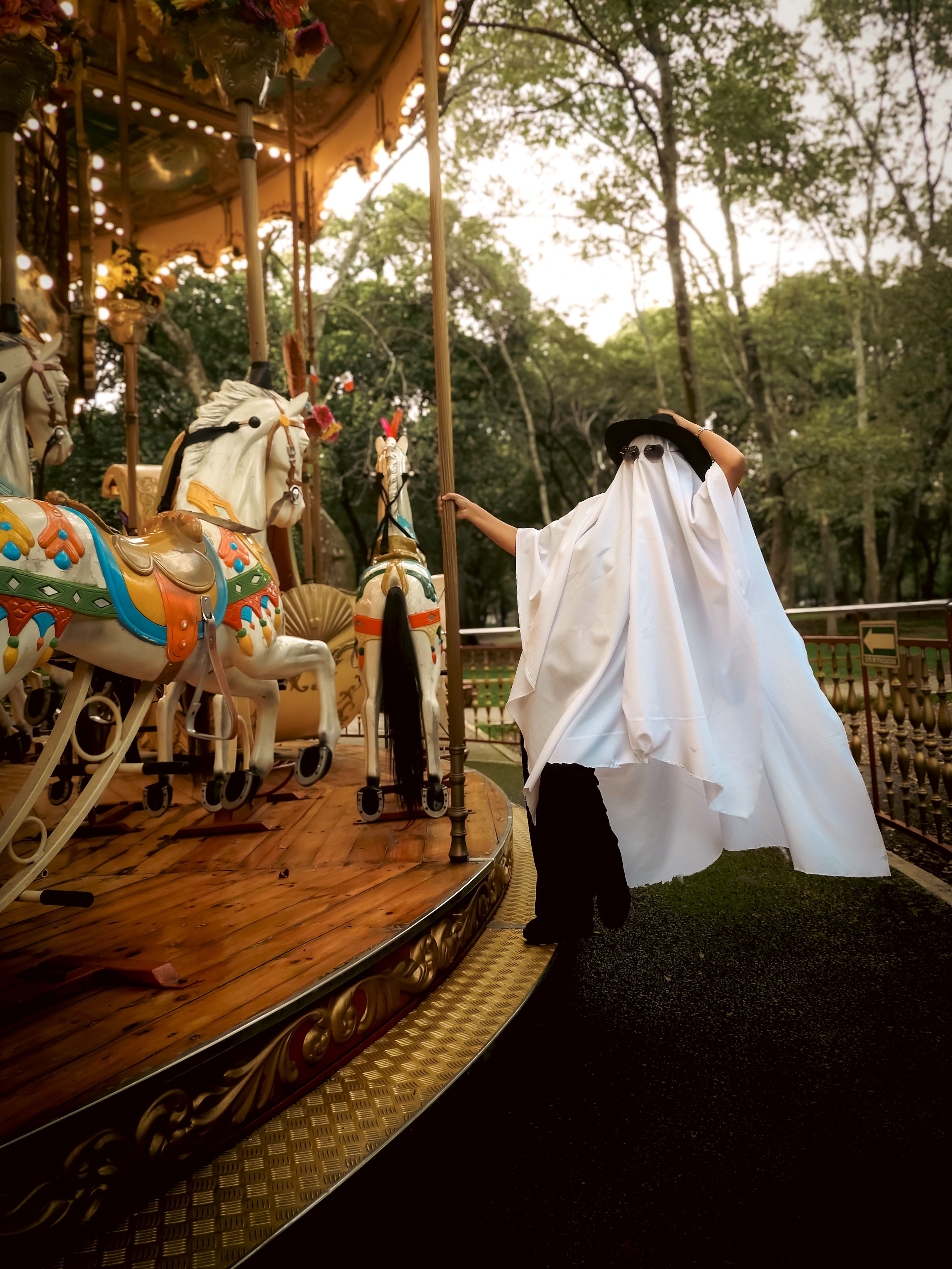 Ghostly Figure on Carousel in Mexico Park · Free Stock Photo