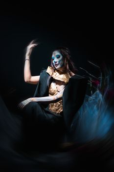 Captivating Day of the Dead portrait featuring cultural makeup and costume art in Mexico City.