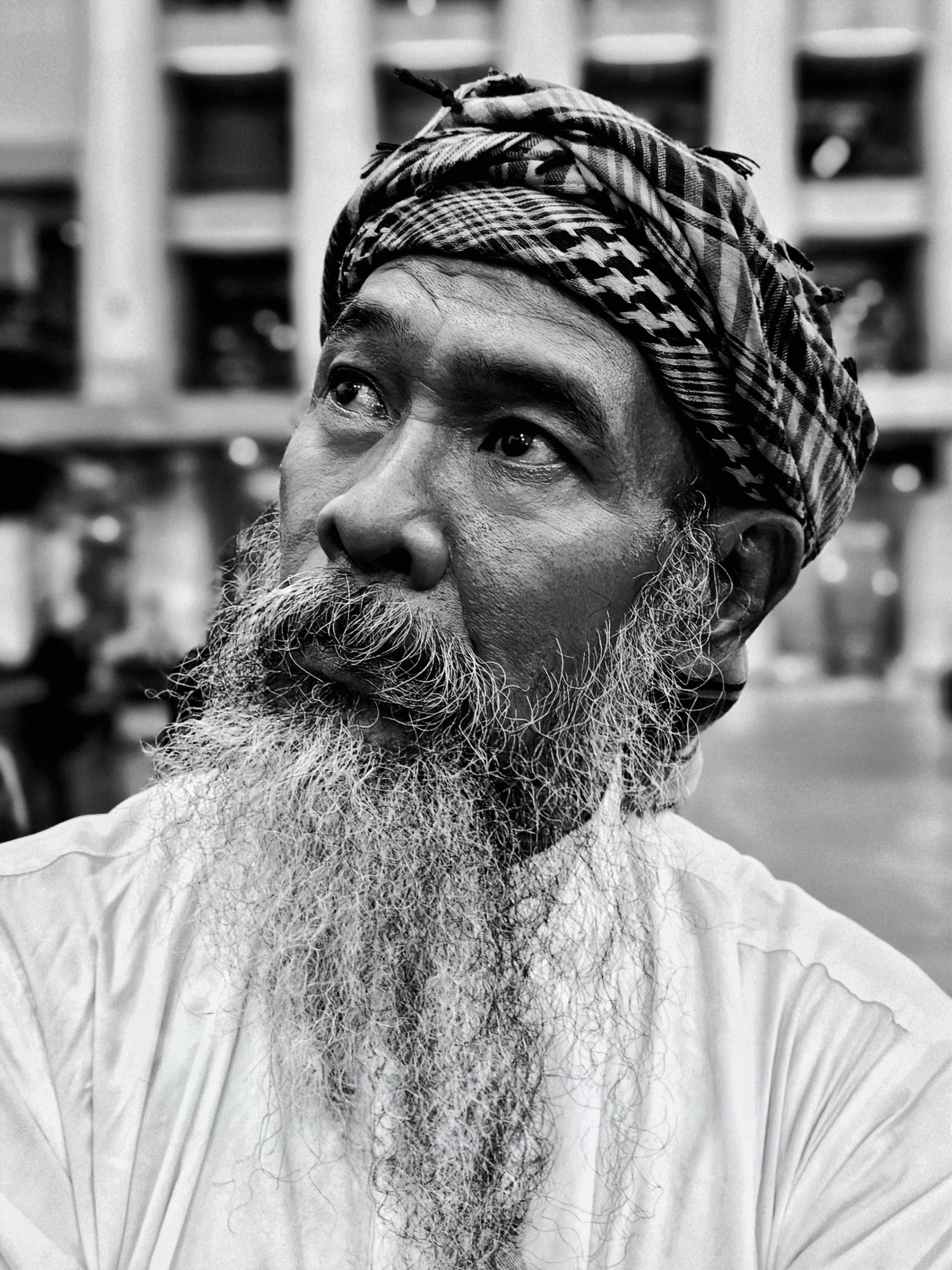 Portrait of a Bearded Man in Traditional Attire · Free Stock Photo