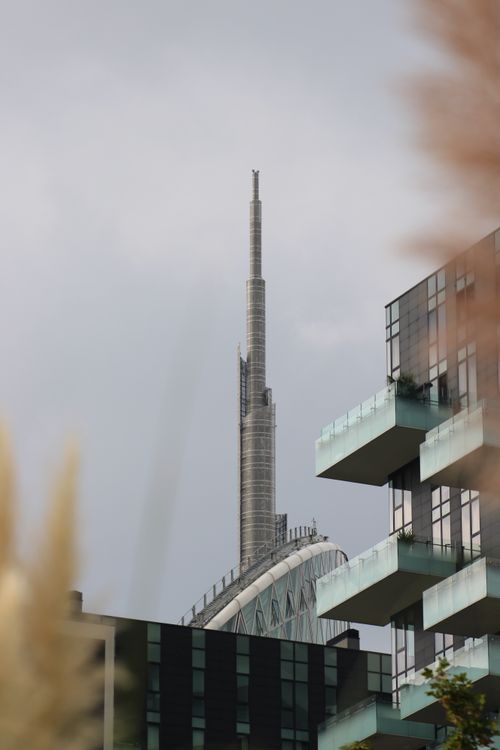 Free View of a modern skyscraper in Milan with contemporary architectural design. Stock Photo