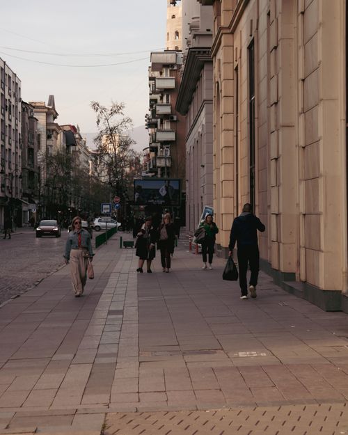 Free Urban street view in Skopje, North Macedonia, with people walking along the sidewalk during the day. Stock Photo