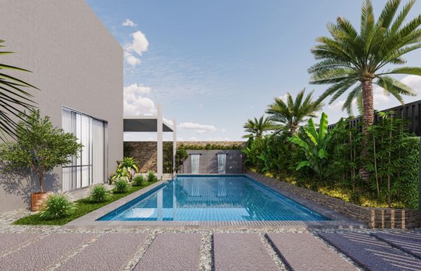 Poolside garden lounge with tropical plants in a UAE villa