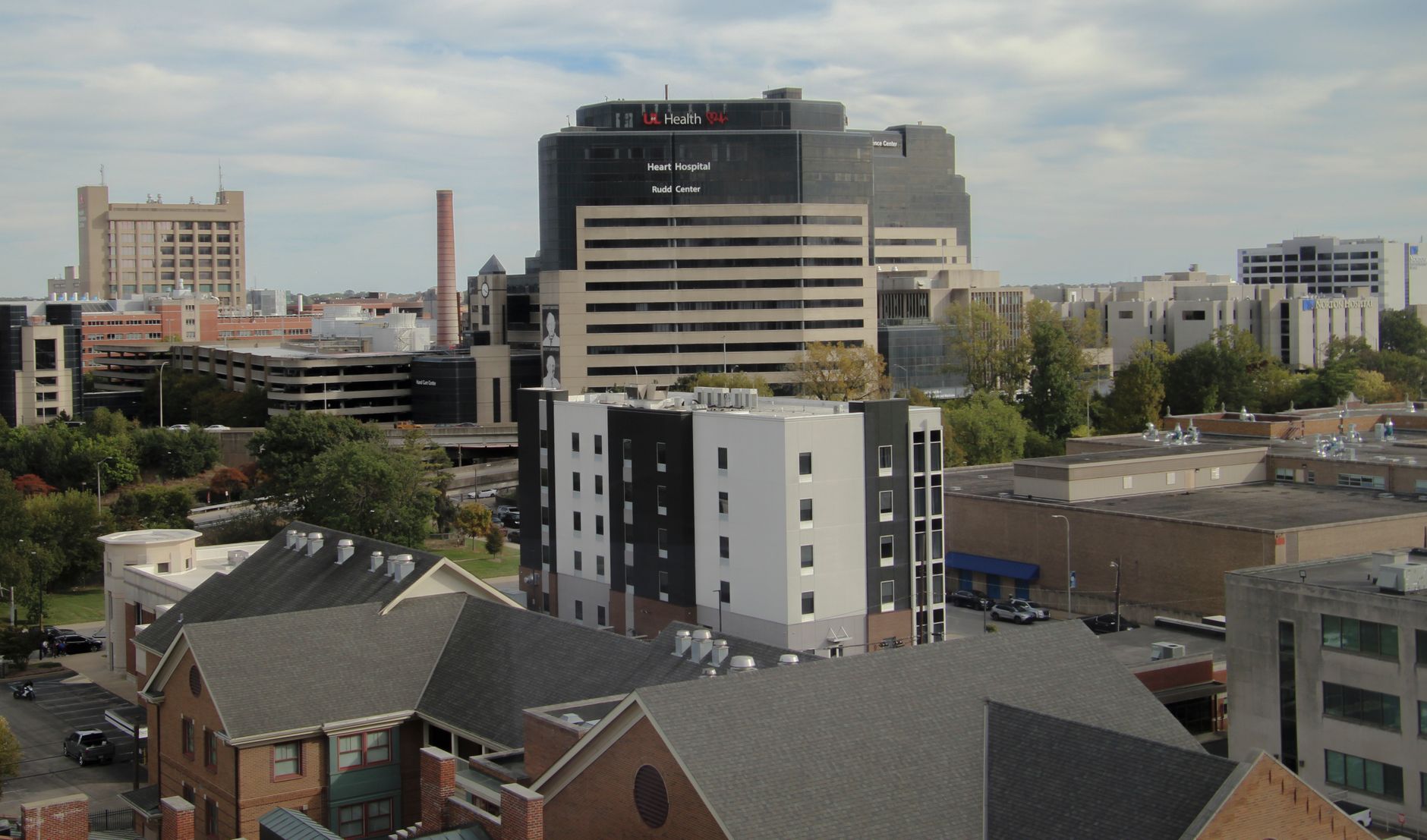 Aerial view of an urban medical center featuring a prominent hospital building.