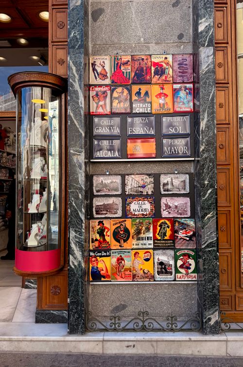 Free Colorful vintage posters on a street in Madrid, Spain, capturing the city's vibrant culture. Stock Photo