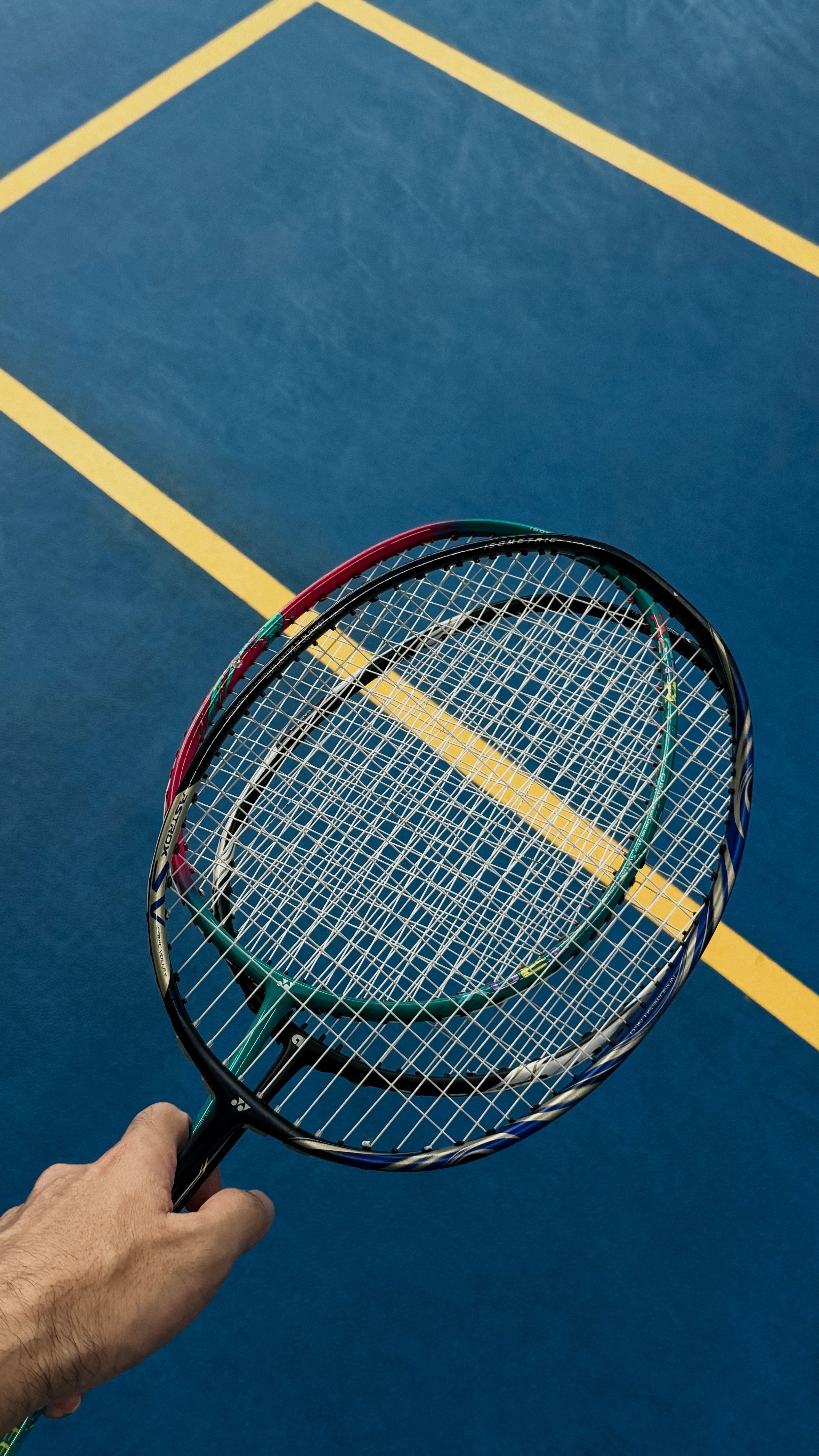Badminton Racket on Blue Court Surface · Free Stock Photo