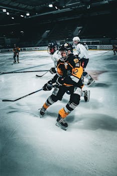 Action-packed ice hockey match with players in motion on the rink.