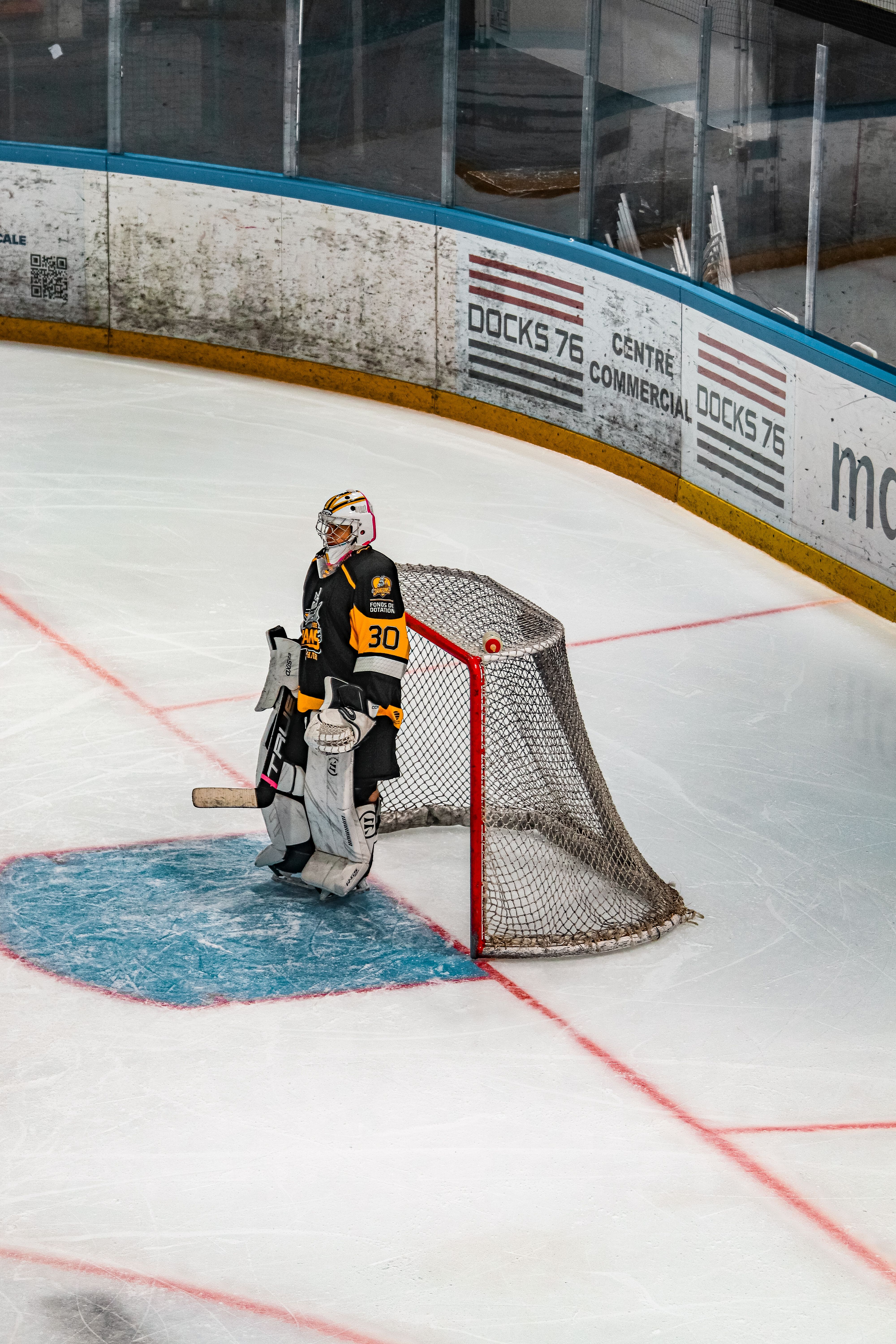 Ice Hockey Goalie in Action on Rink · Free Stock Photo