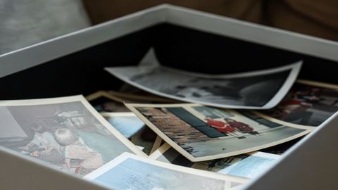 Discover a box of timeless vintage family photos capturing cherished memories.