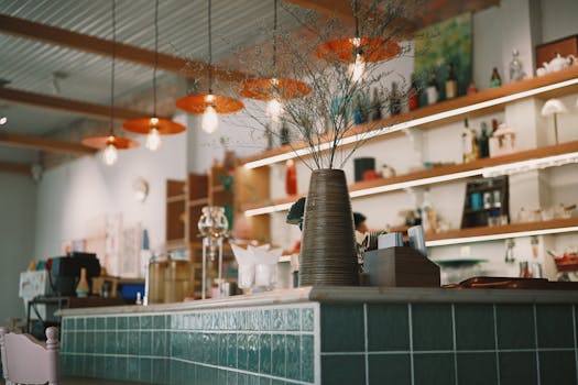 Modern cafe interior featuring stylish decor and bright lighting for a cozy atmosphere.