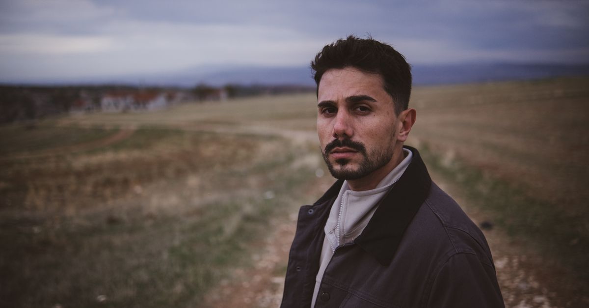 Portrait of a Man in a Rural Landscape · Free Stock Photo
