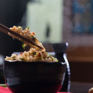 Steaming herb fried rice in a black bowl, photo by Jay Abrantes on Pexels