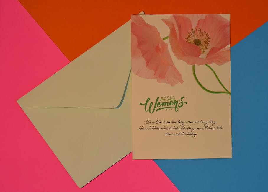 Elegant Women's Day card with pastel floral design and envelope on colorful background.