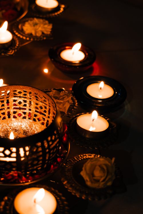 Free Warm glow of diyas and candles during Diwali celebration in India, enhancing festive ambiance. Stock Photo
