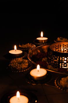 Beautiful candle arrangement with flowers for Diwali celebration in Bengaluru, India.