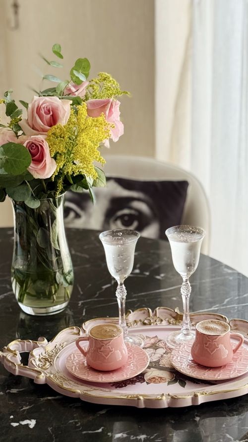 Free Sophisticated table setting with roses and tea, perfect for a refined afternoon. Stock Photo