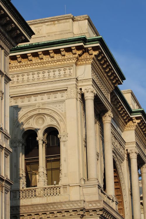 Free Close-up of intricate architectural details on a historic building facade in Milan. Stock Photo