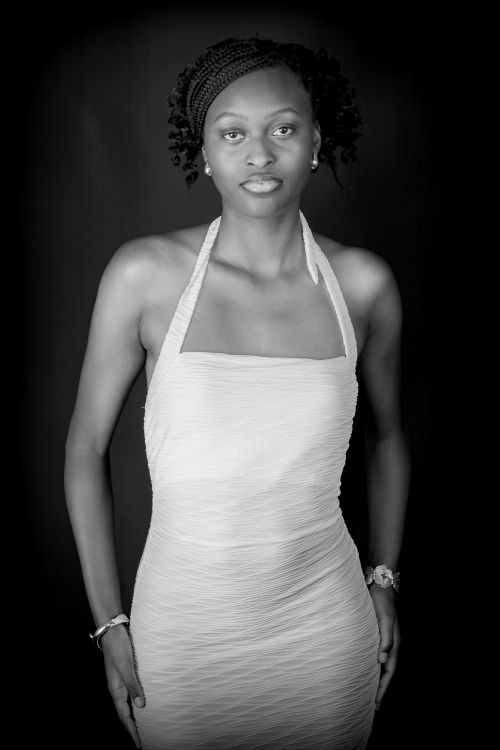 Free Timeless black and white portrait of an elegant woman wearing a halter dress. Stock Photo