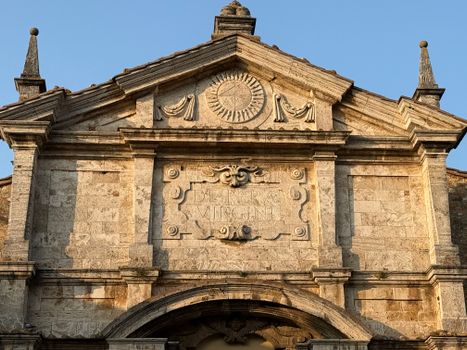 Close-up of the architectural details on a Baroque church facade during daylight.