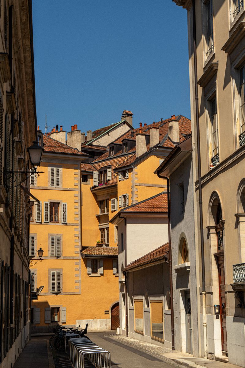Charming narrow street with pastel facades in Geneva's old town