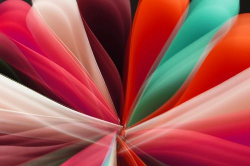 Free Colorful abstract light trails create a dynamic, vibrant pattern against a dark background. Stock Photo
