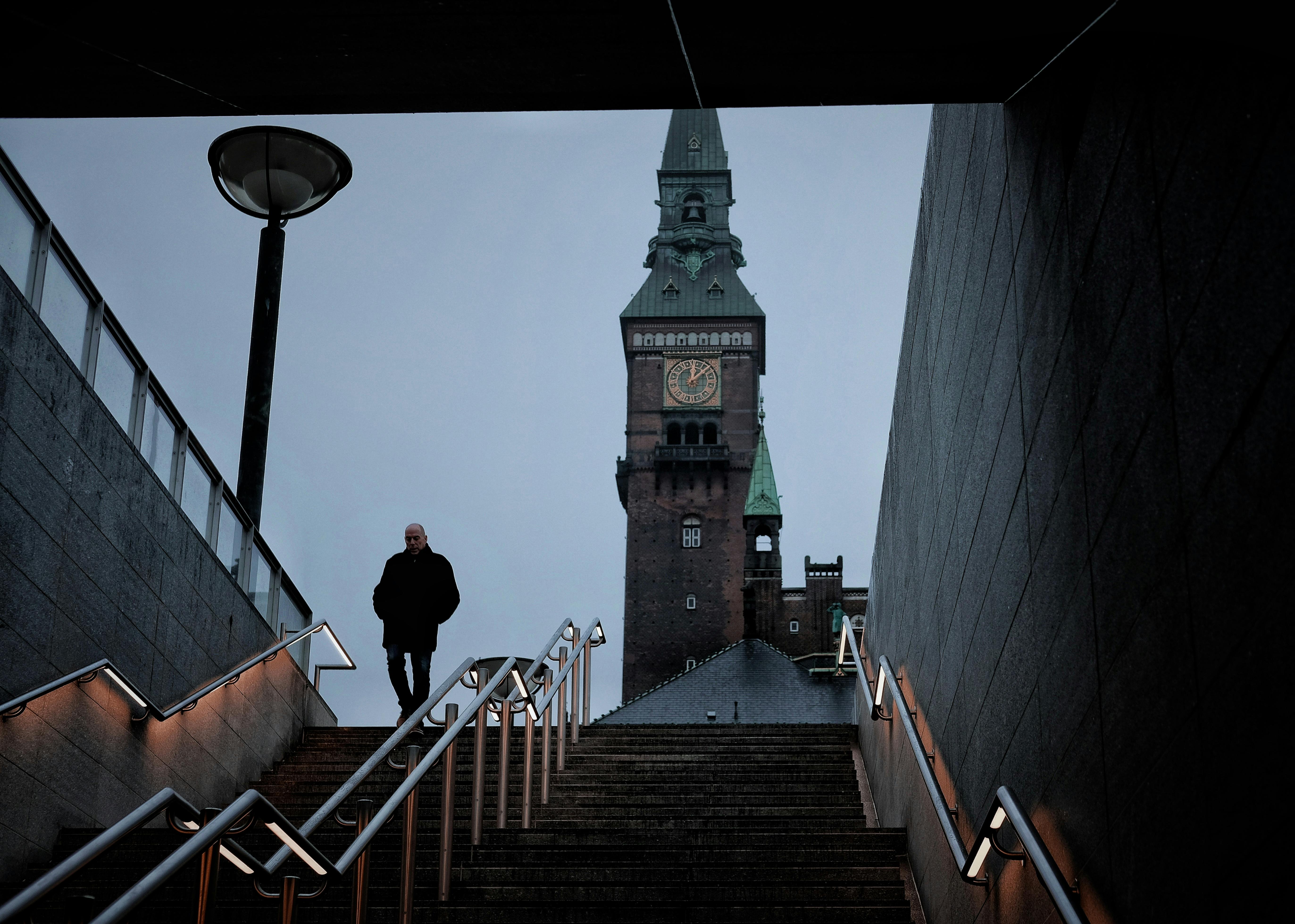 photo of a man going down the stair
