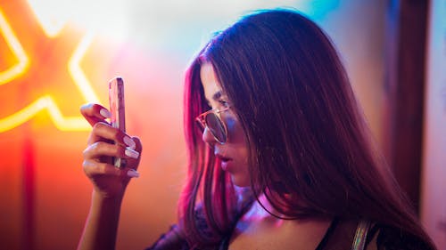 Photo Of Woman Holding Phone 