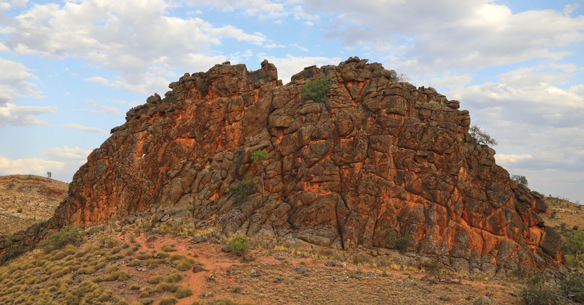 Rock formations in Australia's Northern Territory under an evening sky.