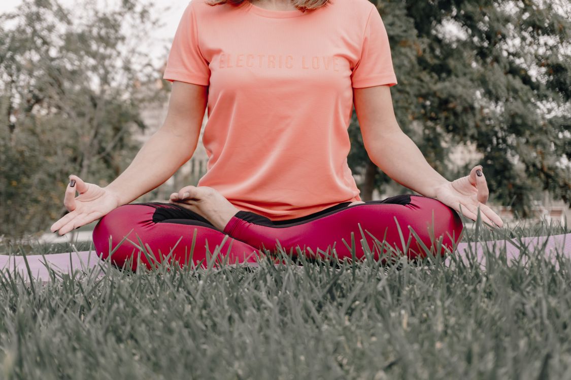 Woman Meditating Outdoors on Yoga Mat · Free Stock Photo