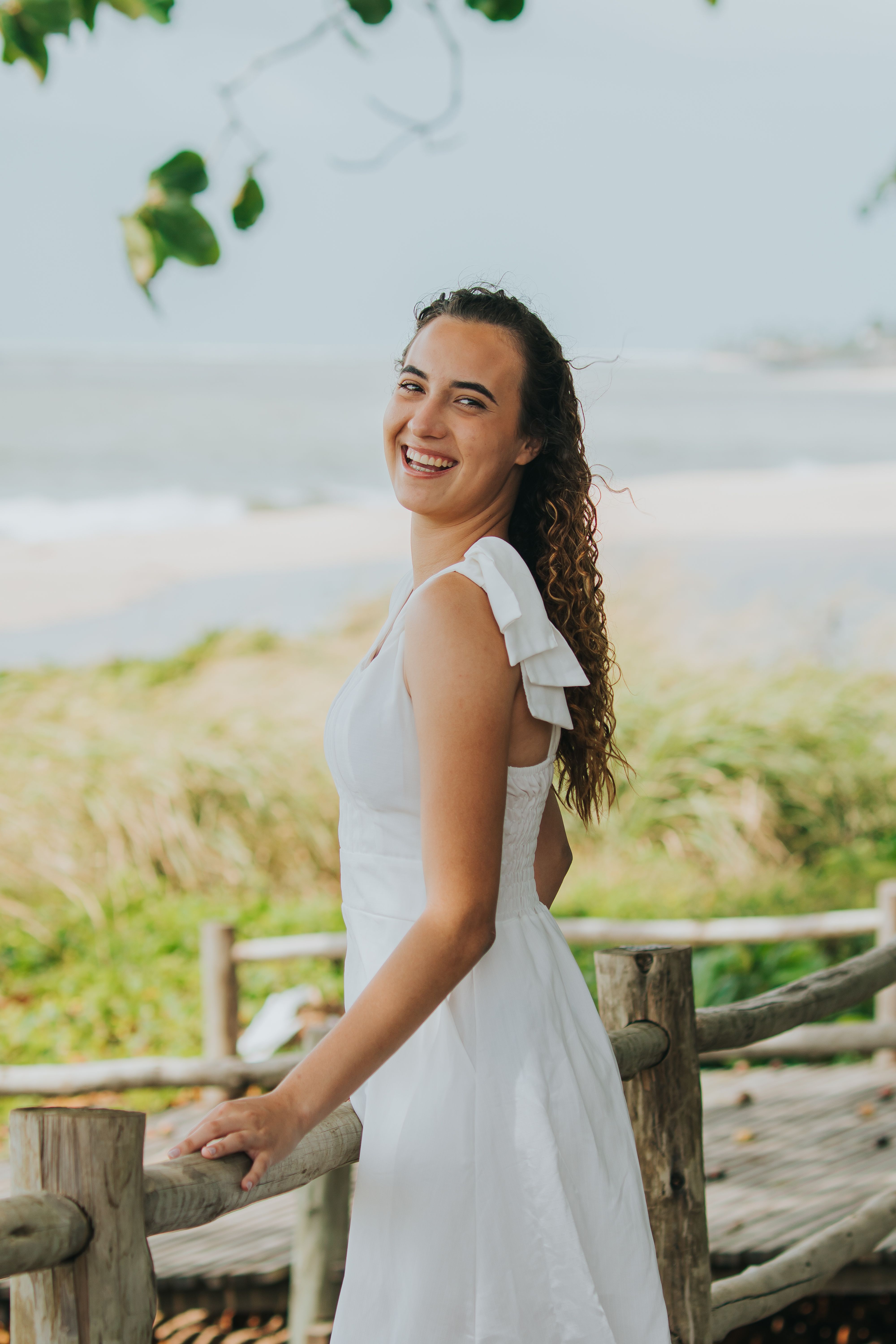 Smiling Woman in White Dress at Beach · Free Stock Photo