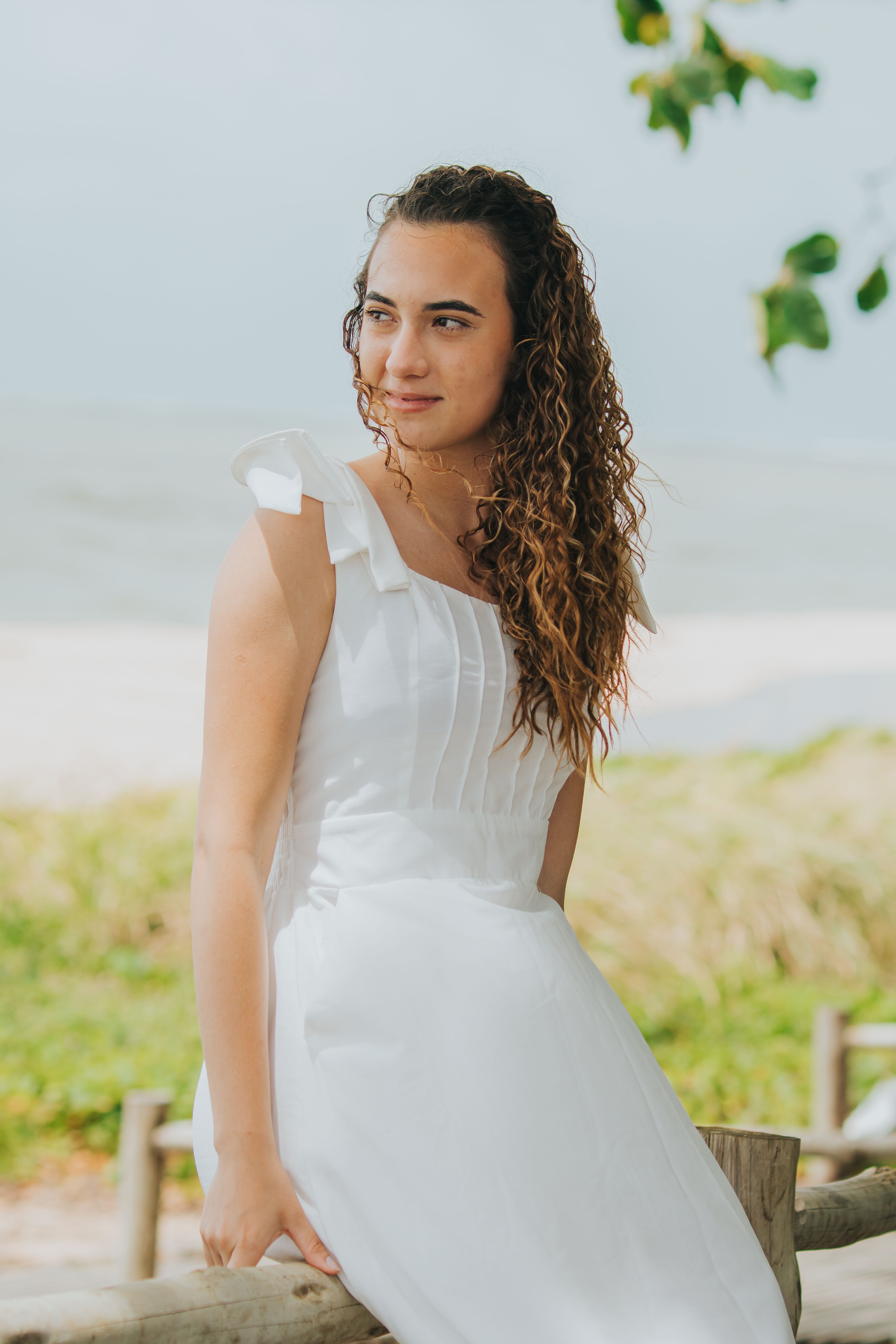 Smiling Woman in White Dress at Beach · Free Stock Photo