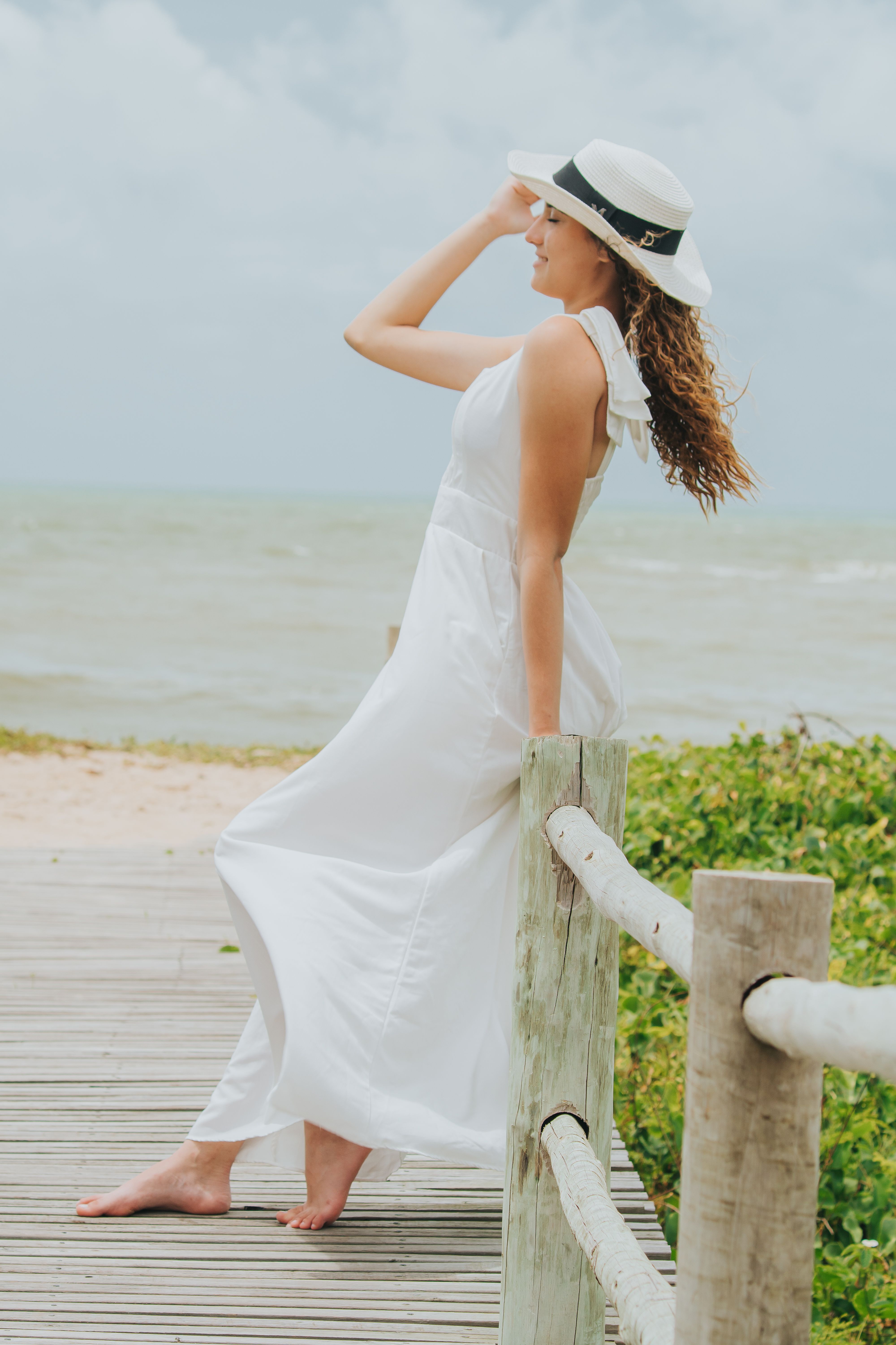 Woman in White Dress Enjoying Beach Day  Free Stock Photo